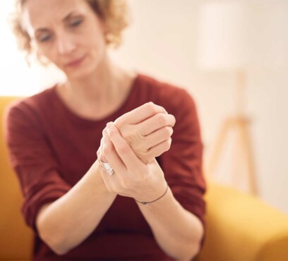 Caucasian female patient holding her clenched fist