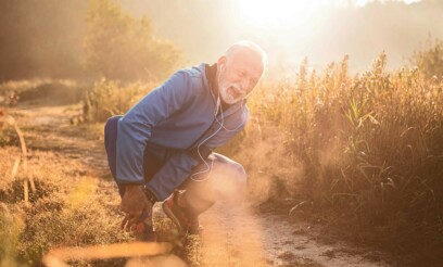 Senior caucasian male patient holding his ankle in pain